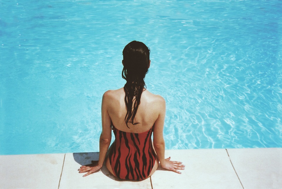 girl sitting in poolside